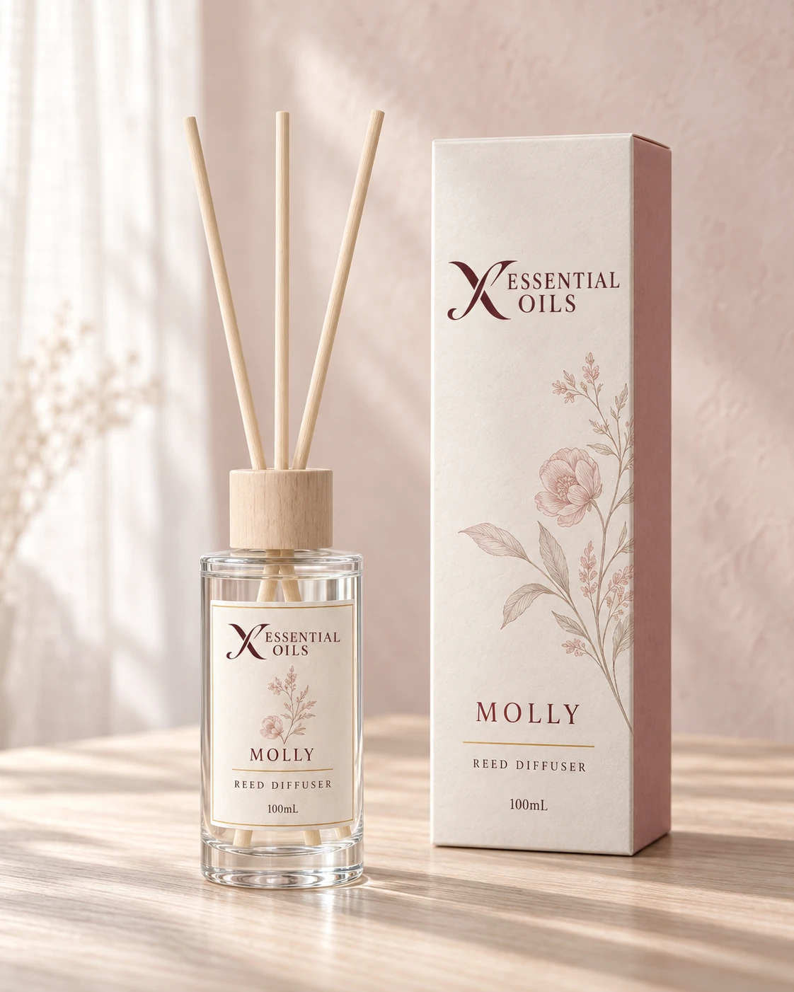 Molly 100mL reed diffuser with X Essential Oils branding in a carefully styled setting.