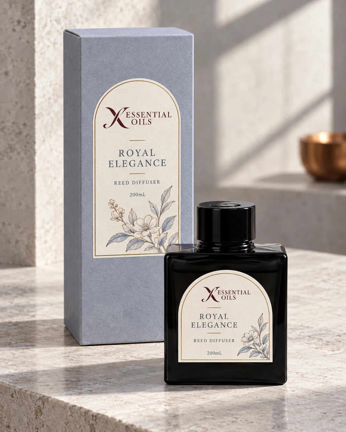 Royal Elegance 200mL reed diffuser with X Essential Oils branding in a carefully styled setting.